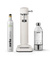 Aarke Carbonator 3 in Matte White displayed with a 100% renewable CO2 cylinder next to a filled PET water bottle.