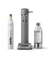 Aarke Carbonator 3 in Matte grey displayed with a 100% renewable CO2 cylinder next to a filled PET water bottle.