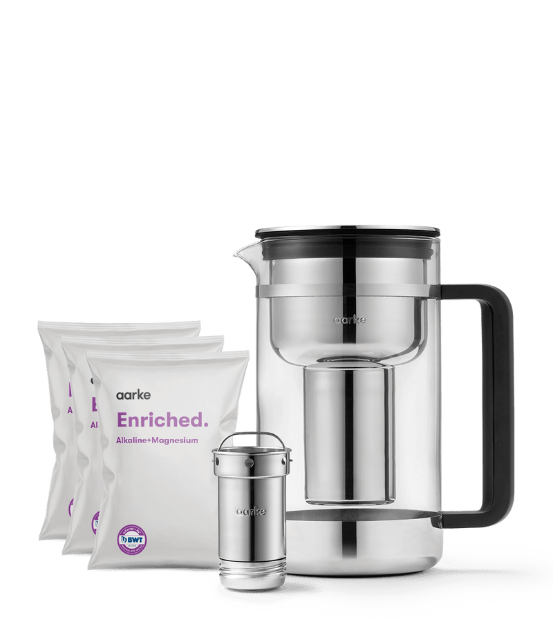 Front view of Aarke Purifier Large Mineralisation Kit including three Enriched refill bags, one steel cartridge, and a Purifier Large.