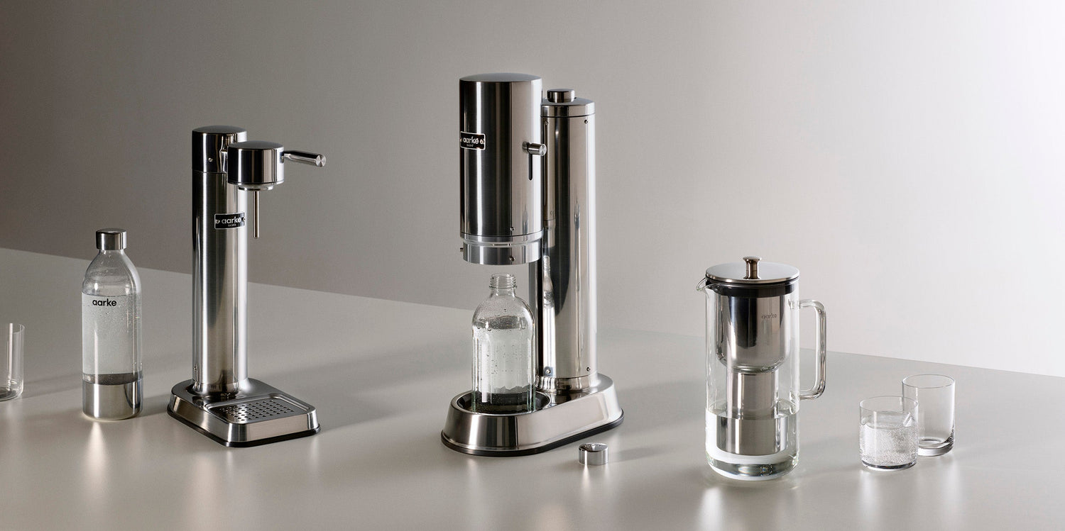 From left to right: The Aarke PET Bottle, Carbonator 3 in Stainless Steel, Carbonator Pro in Stainless Steel, Water Filter Pitcher, and Nesting Glasses.