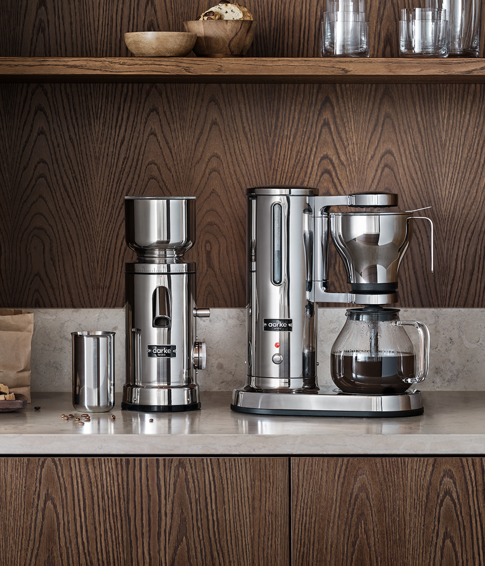 aarke coffee grinder and coffee maker standing on kitchen countertop