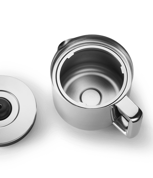 Top view of an open Aarke stainless steel thermal jug and matching lid, showing the insulated interior design.