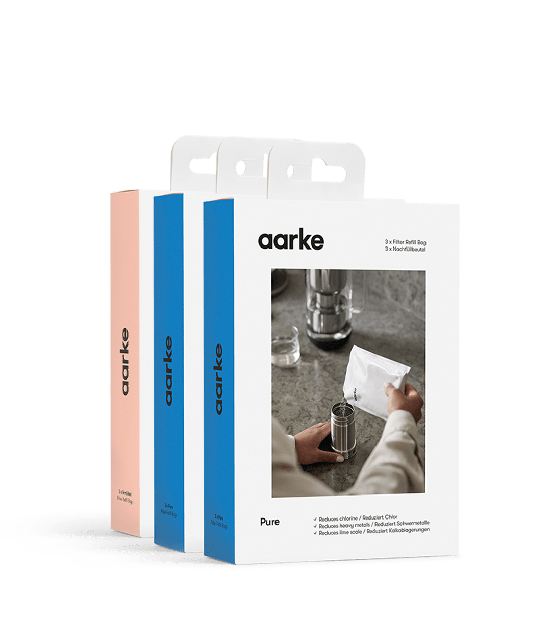 Three Aarke filter refill boxes in different colors, displayed side by side.
