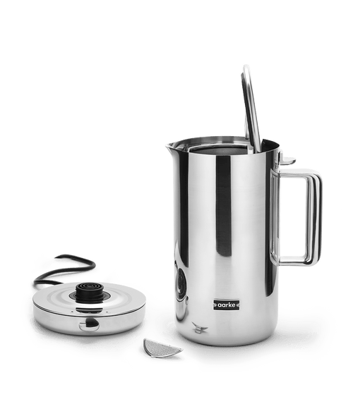 Aarke Stainless Steel Kettle. Base beside the open kettle.