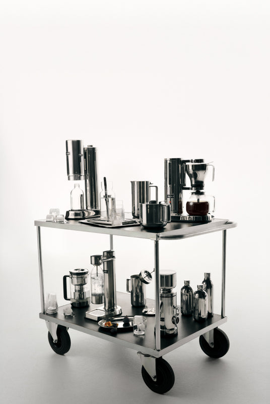 Collection of Aarke products on a metal cart with a white background