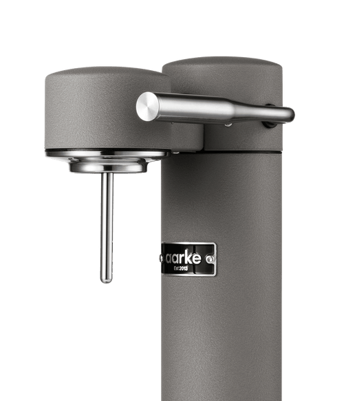 Close-up of the Aarke Carbonator 3 in Matte grey, highlighting the carbonation lever and nozzle.