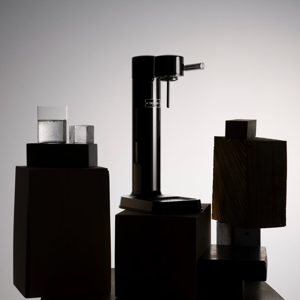 Black coffee grinder on a gray background