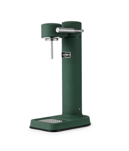 Aarke Carbonator 3 in Heritage Green, a premium sparkling water maker with a stainless steel carbonation nozzle and drip tray.