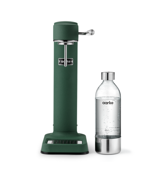 Aarke Carbonator 3 Heritage Green, a SodaStream sparkling water maker standing next to an Aarke BPA-free PET water bottle with a stainless steel cap.