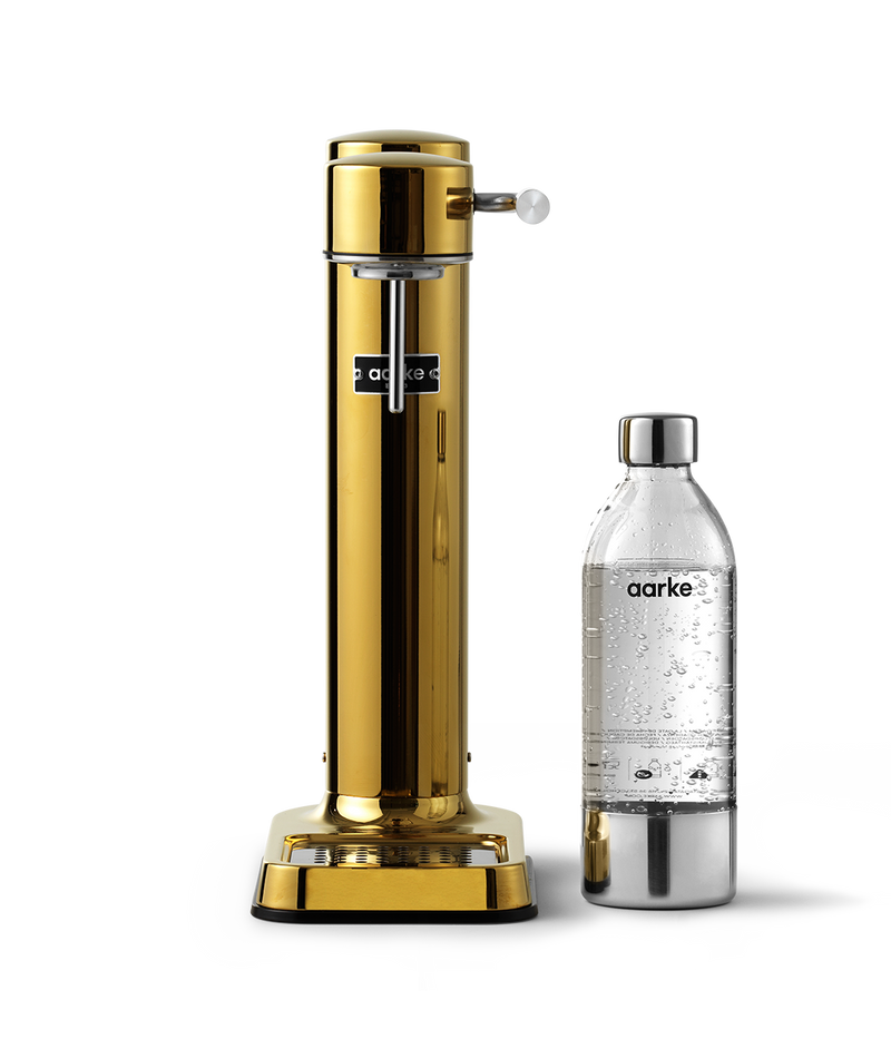 Aarke Carbonator 3 in Gold. Front view with PET bottle.