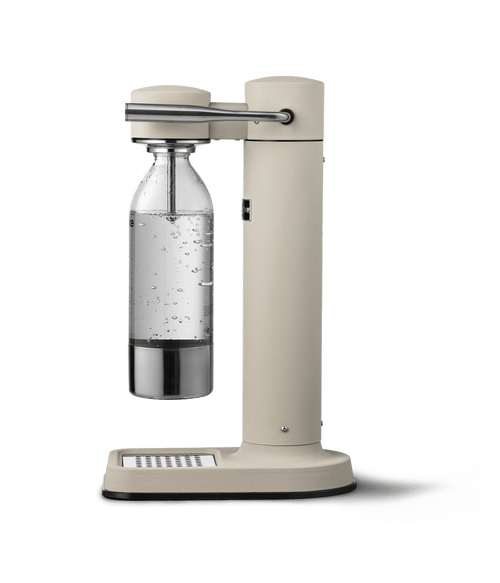 Side view of Aarke Carbonator 3 in Sand with PET bottle attached.