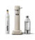 Front view of the Carbonator 3 in Sand beside a PET water bottle and 1 Aarke CO2 Cylinder.