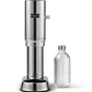 Aarke Carbonator Pro in Stainless Steel. Front view with chamber open and Glass Bottle sitting beside the Carbonator/