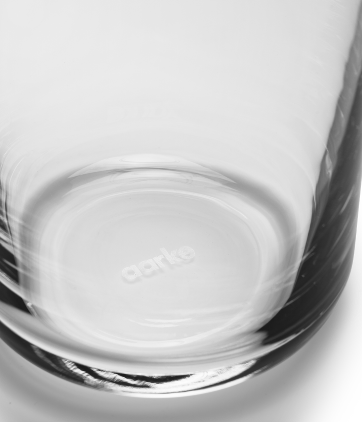 Close up of the base of the Nesting Carafe showing the Aarke logo etched into the glass/