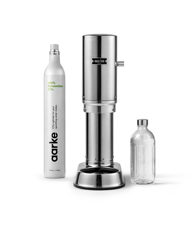 Aarke Carbonator Pro in Stainless Steel with 1 Aarke CO2 Cylinder and 1 Glass Bottle.
