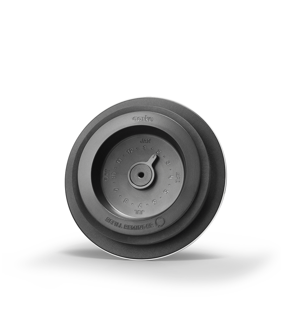 Close-up of the Aarke water purifier lid featuring a built-in date dial for refill reminders.